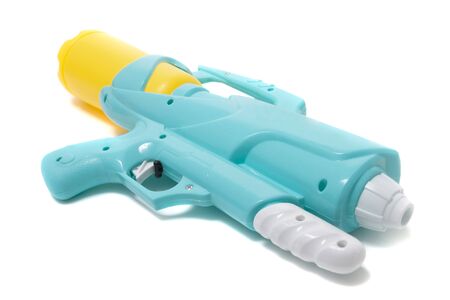Colorful plastic water gun isolated on a white background.の写真素材