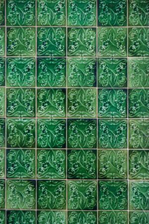 Close view of a beautiful pattern of portuguese ceramic azulejo tiles.