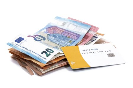 Euro money bills with credit card isolated on a white background.