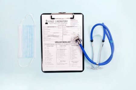 Various virus and laboratory test report concept, for coronavirus, rabies, hepatitis and others with face mask and stethoscope and other items.の写真素材