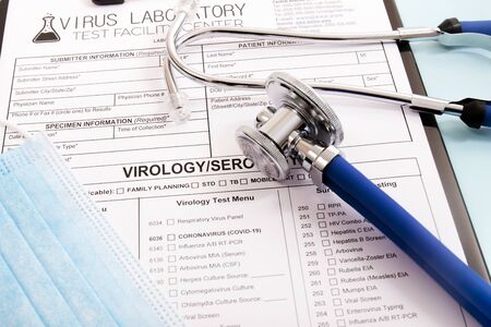 Various virus and laboratory test report concept, for coronavirus, rabies, hepatitis and others with face mask and stethoscope and other items.の写真素材