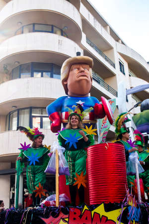 LOULE, PORTUGAL - FEBRUARY 2020: Colorful Carnival (Carnaval) Parade festival participants on Loule city, Portugal.のeditorial素材