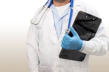 View of caucasian doctor with clipboard report analysis.