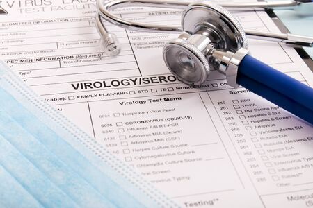Various virus and laboratory test report concept, for coronavirus, rabies, hepatitis and others with face mask and stethoscope and other items.の写真素材