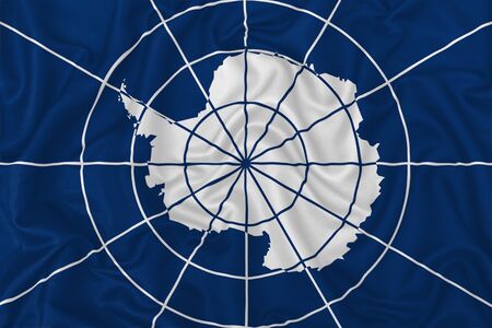 Antarctic Treaty flag on wavy silk textile fabric background.の写真素材