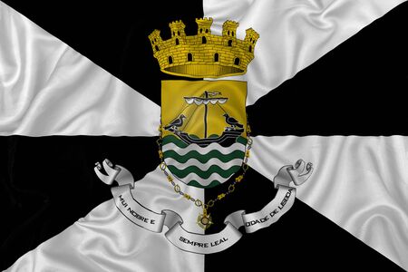 Lisbon capital  flag on wavy silk textile fabric background.の写真素材