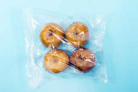 fresh organic rennet apples from the grocery market on a plastic bag.