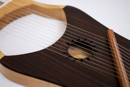 stringed lyre musical instrument isolated on a white background.