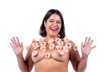 girl with flowers on her body simbolizing spring and sensuality over a white background.の写真素材