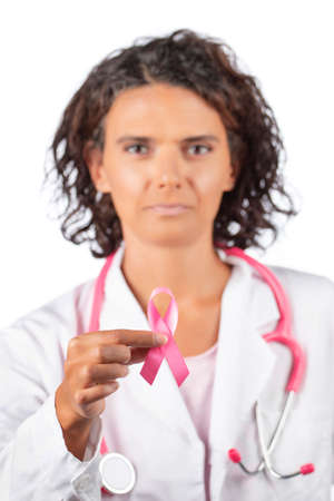 Young woman checking breast (auto self exam) for anomalies, nodes or weird lumps for breast cancer.の写真素材