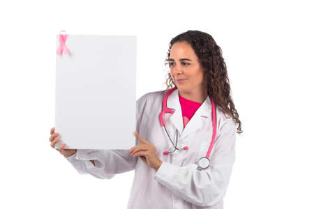 Caucasian doctor woman holding white board on a white background.の写真素材