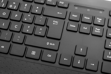 Close up view of a wireless black personal computer keyboard.の写真素材