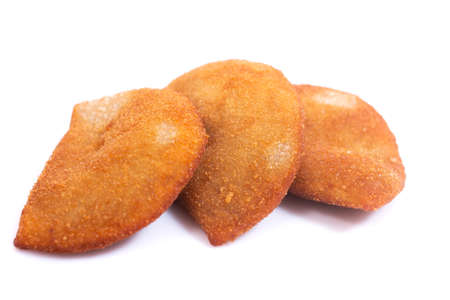 Typical Portuguese deep fried rissol appetizers, generally with meat or shrimp isolated on a white...