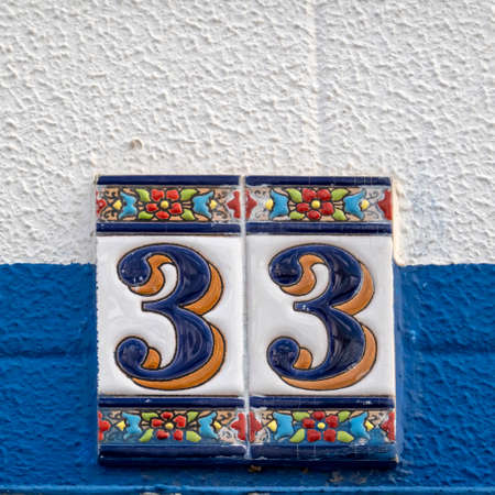 Typical architecture of Algarve vintage style house numbers, located in Olhao, Portugal.の写真素材