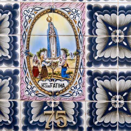 Typical details of azulejo ceramics artwork located in the city of Olhao, Portugal