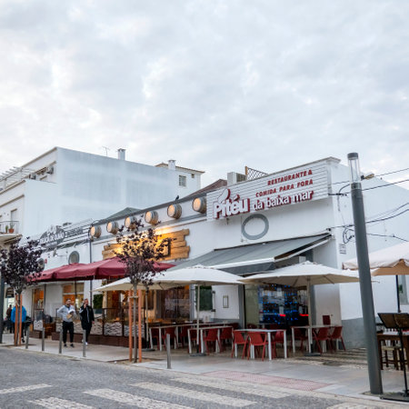 OLHAO, PORTUGAL - 19th DECEMBER 2021: Typical restaurants and businesses of Algarve vintage style buildings, located in Olhao, Portugal.のeditorial素材