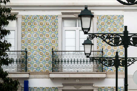 Typical architecture of Algarve rustic buildings with intricate designs of platbands.