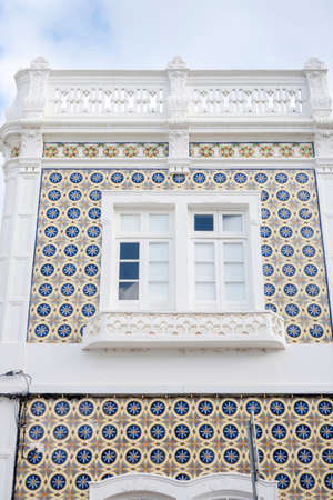 Typical architecture of Algarve rustic buildings with intricate designs of platbands.の写真素材