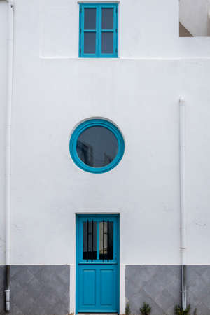 Typical architecture door with intricate design details of traditional Portuguese buildings.の写真素材