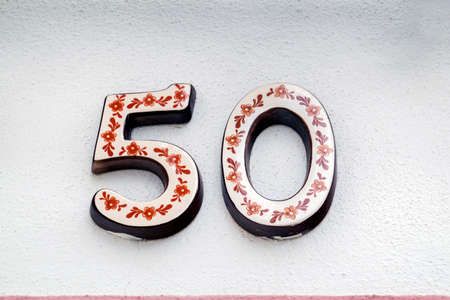 Beautiful house number fifty in azulejo tile, typical of Portuguese houses.の写真素材