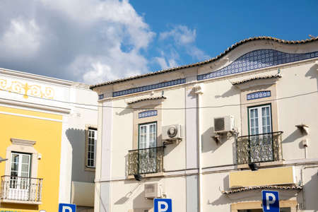View of the typical architecture of Loule city with traditional colorful buildings, Algarve,...