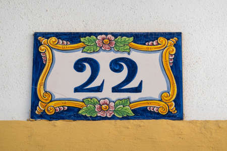 Beautiful house number twenty two in azulejo tile, typical of Portuguese houses.の写真素材