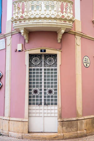 Typical architecture door with intricate design details of traditional Portuguese buildings.の写真素材
