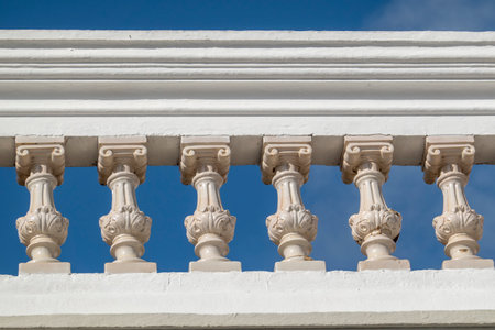 White terrace ceramic pillars in the typical architecture of Algarve houses, Portugal.