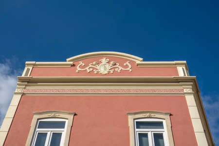 Typical architecture of Algarve rustic buildings with intricate designs of platbands.の写真素材