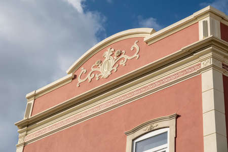 Typical architecture of Algarve rustic buildings with intricate designs of platbands.