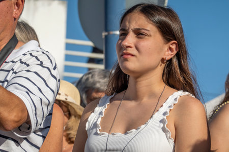 MERTOLA, PORTUGAL - 22nd MAY 2022: Audience member watches an Islamic event inspired on Moroccan culture, with tents, dancers, music, crafts and food taken place on Mertola village.のeditorial素材