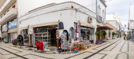 OLHAO, PORTUGAL - 13th FEBRUARY 2022: Typical architecture of Algarve rustic buildings with intricate designs of platbands and narrow cobblestone streets.のeditorial素材