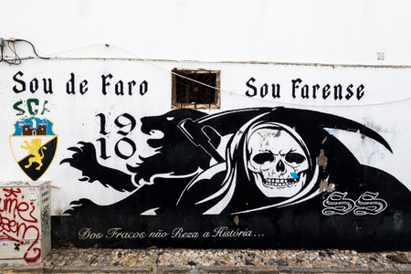 FARO, PORTUGAL - 27th MARCH 2022: Character of death graffiti on a wall in Faro cityのeditorial素材