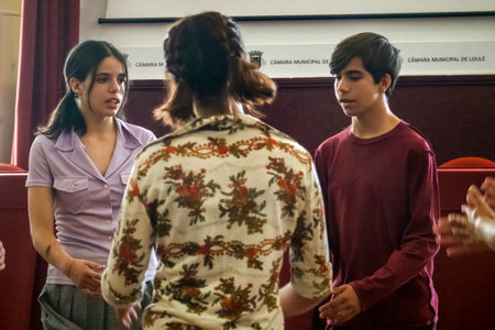 LOULE, PORTUGAL - 25th JUNE 2022 - Contemporary dancing and singing teens doing a performance group on a local theater.のeditorial素材
