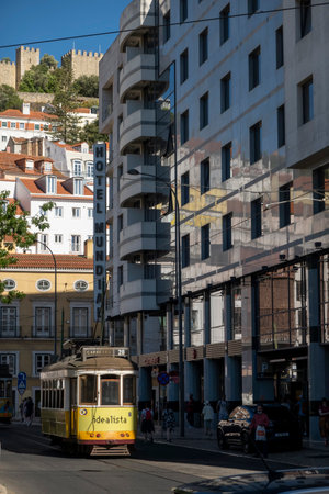 LISBON, PORTUGAL, 28th JUNE 2022: View of the popular vintage tram vehicle used for the transportation of tourists and commuters around the city of Lisbon, Portugalのeditorial素材