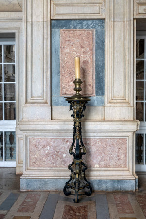 MAFRA, PORTUGAL - 29th JUNE 2022: Close up view detail of an Antique detailed candle stand, located in Mafra convent, Portugal.のeditorial素材