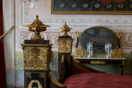 MAFRA, PORTUGAL - 29th JUNE 2022: Close up view of an ancient highly detailed wooden bed at display on the convent of Mafra, Portugal.のeditorial素材