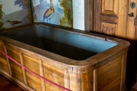 MAFRA, PORTUGAL - 29th JUNE 2022: Large antique bathtub made of hardwood located on the Convent of Mafra, Portugalのeditorial素材