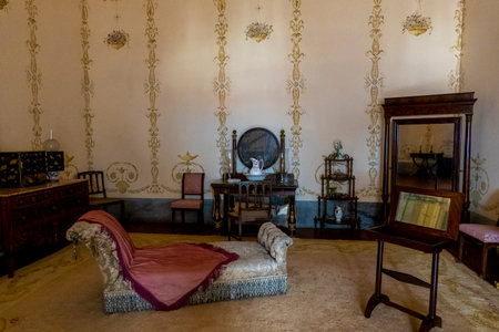 MAFRA, PORTUGAL - 29th JUNE 2022: Close up view of an ancient highly detailed room with antique furniture at display on the convent of Mafra, Portugal.のeditorial素材