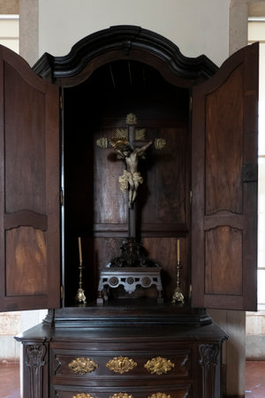 MAFRA, PORTUGAL - 29th JUNE 2022: Close up view of a Wooden cross of Jesus Christ crucified.のeditorial素材