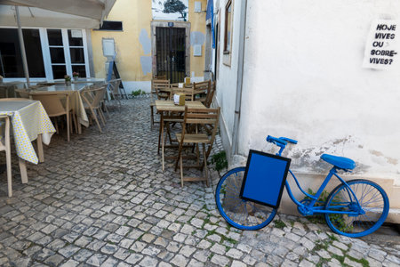 SINTRA, PORTUGAL - 27th JUNE 2022: Narrow streets of Sintra village with various businesses, including restaurants and souvenirs.のeditorial素材