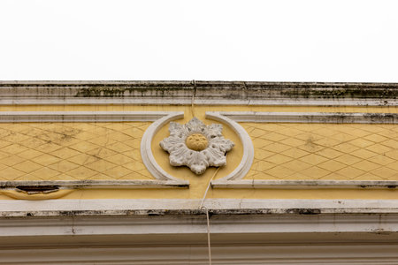 Typical architecture of Algarve rustic buildings with intricate designs of platbands.