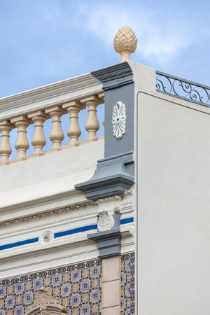 Typical Portuguese house details from the Algarve, with detailed platbands and colorful azulejo tiles.の写真素材