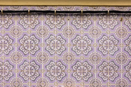 Typical architecture of Fuseta buildings with cute tile design and intricate details, Algarve,...
