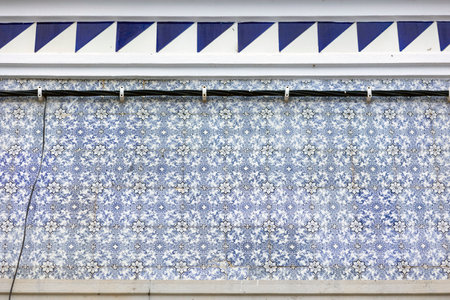 Typical architecture of Fuseta buildings with cute tile design and intricate details, Algarve, Portugal.の写真素材