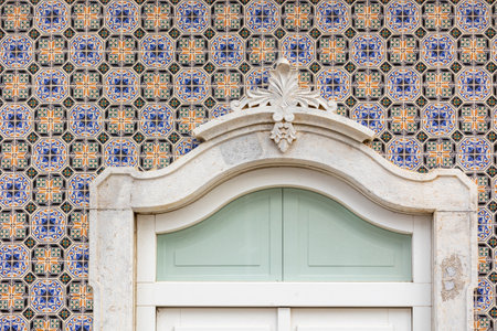 Typical Portuguese house details from the Algarve, with detailed platbands and colorful azulejo...