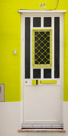 Close view of beautiful details of typical doors and azulejo tiles, from Portuguese houses.の写真素材