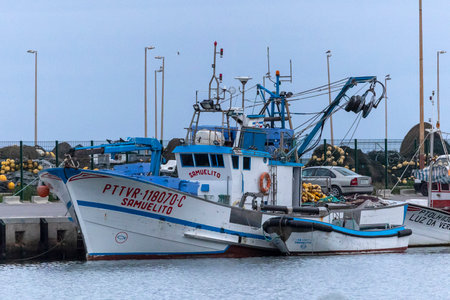 OLHAO, PORTUGAL - 11th DECEMBER 2022: Traditional fishing boats on the docks of Olhao city, Portugal.のeditorial素材