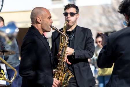 QUERENCA, PORTUGAL - 24th January 2023: Street music band performing at an outdoor festival in Querenca, Algarve, Portugal.のeditorial素材
