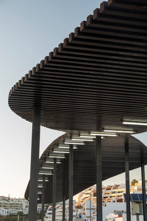 Abstract wooden structure for shade located in Albufeira city.